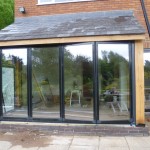hand crafted oak extension - with Glass folding doors